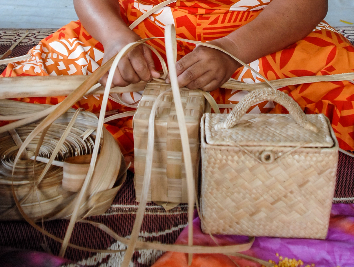 A Dexterous hands weaving handbags, Mangaia